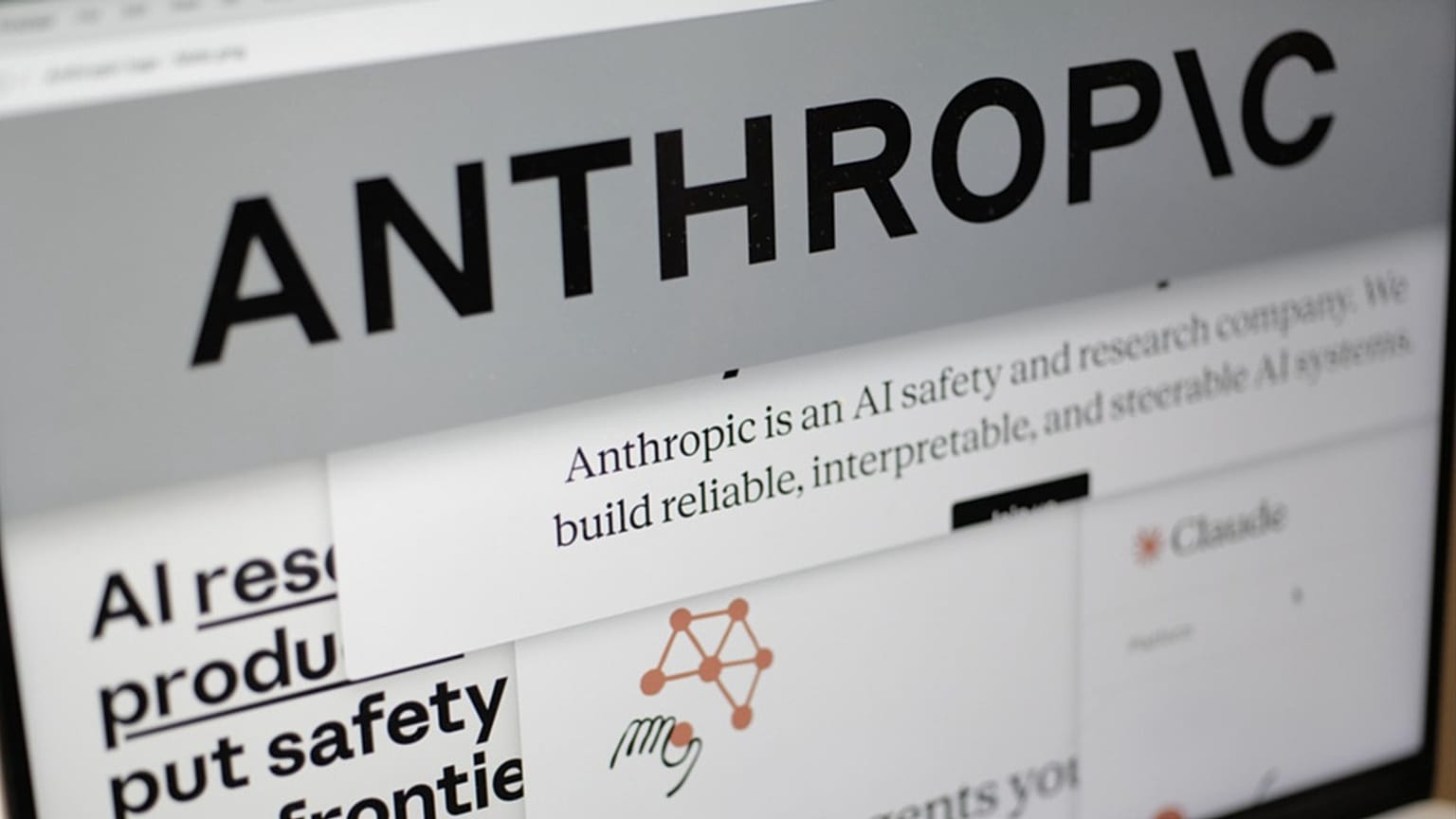 FILE - Pages from the Anthropic website and the company's logo are displayed on a computer screen in New York, Feb. 26, 2026