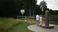 People visit the area of tripoint marking the place where borders of Poland, Lithuania and Russia's Kaliningrad Oblast meet in Zerdziny, Poland, 7 July, 2022.