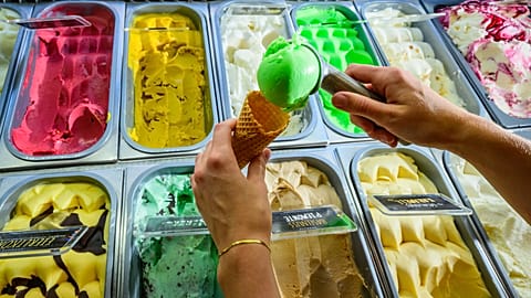 File - Ice-cream is scooped onto a cone at an ice-cream shop in Beeskow, Germany, Wednesday, 24 June 24, 2026.