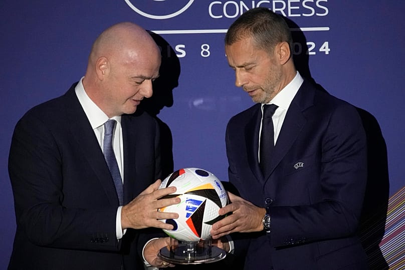 UEFA President Aleksander Ceferin, right, and FIFA President Gianni Infantino pose during the 48th UEFA congress in Paris, Thursday, Feb. 8, 2024.