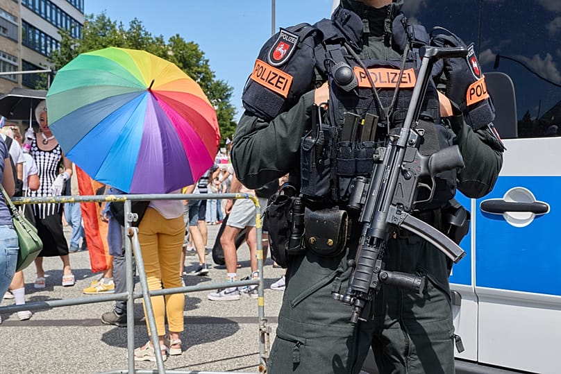 A police officer stands on Steindamm at the edge of Hamburg Pride 2026, the Christopher Street Day (CSD) parade, in Hamburg, Germany, Saturday Aug. 1, 2026.