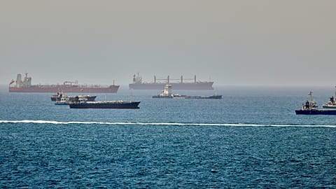 Tankers and cargo vessels are seen in the Gulf of Oman along shipping routes linking the Strait of Hormuz and the Arabian Sea on 16 June 2026.