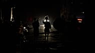 People walk along a street during a blackout in Havana, 6 July, 2026