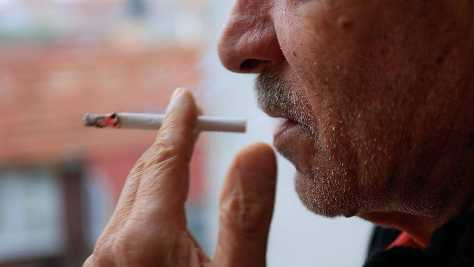 A man smoking a cigarette