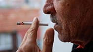 A man smoking a cigarette