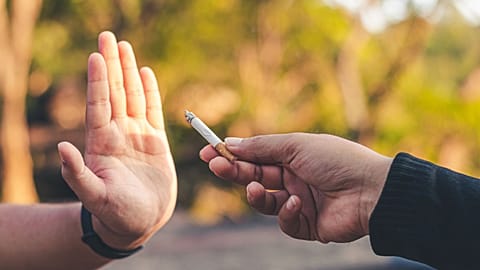 A cigarette is rejected by a non-smoker.