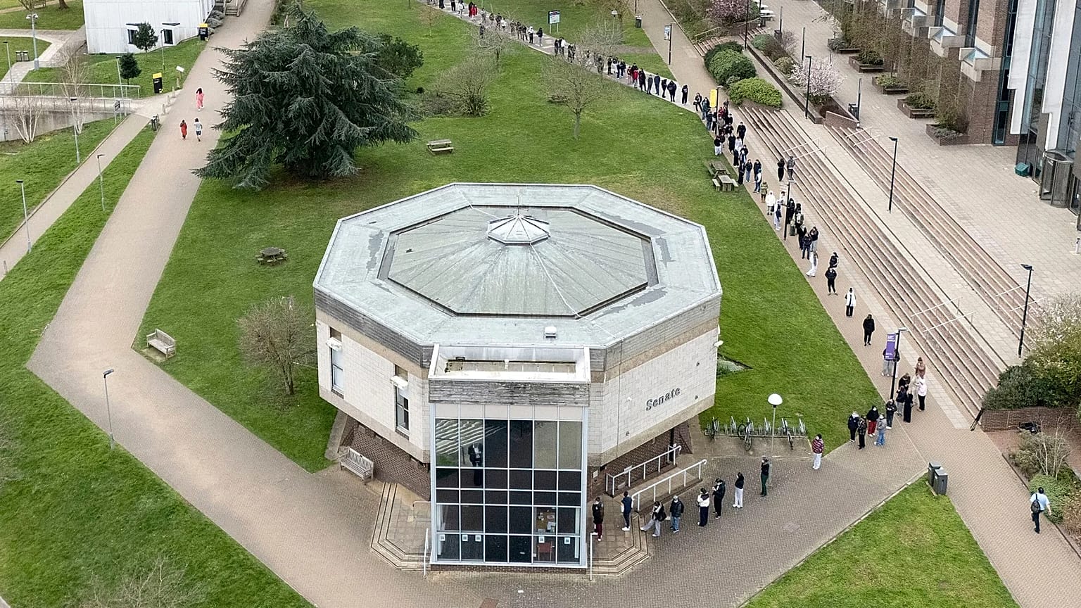 Students outside a building at the University of Kent, in Canterbury, Kent, England, Monday March 16, 2026.
