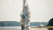 The Romanian Navy detonates underwater explosives during a controlled demolition of submerged rocks to improve water flow to the Cernavoda nuclear power plant.