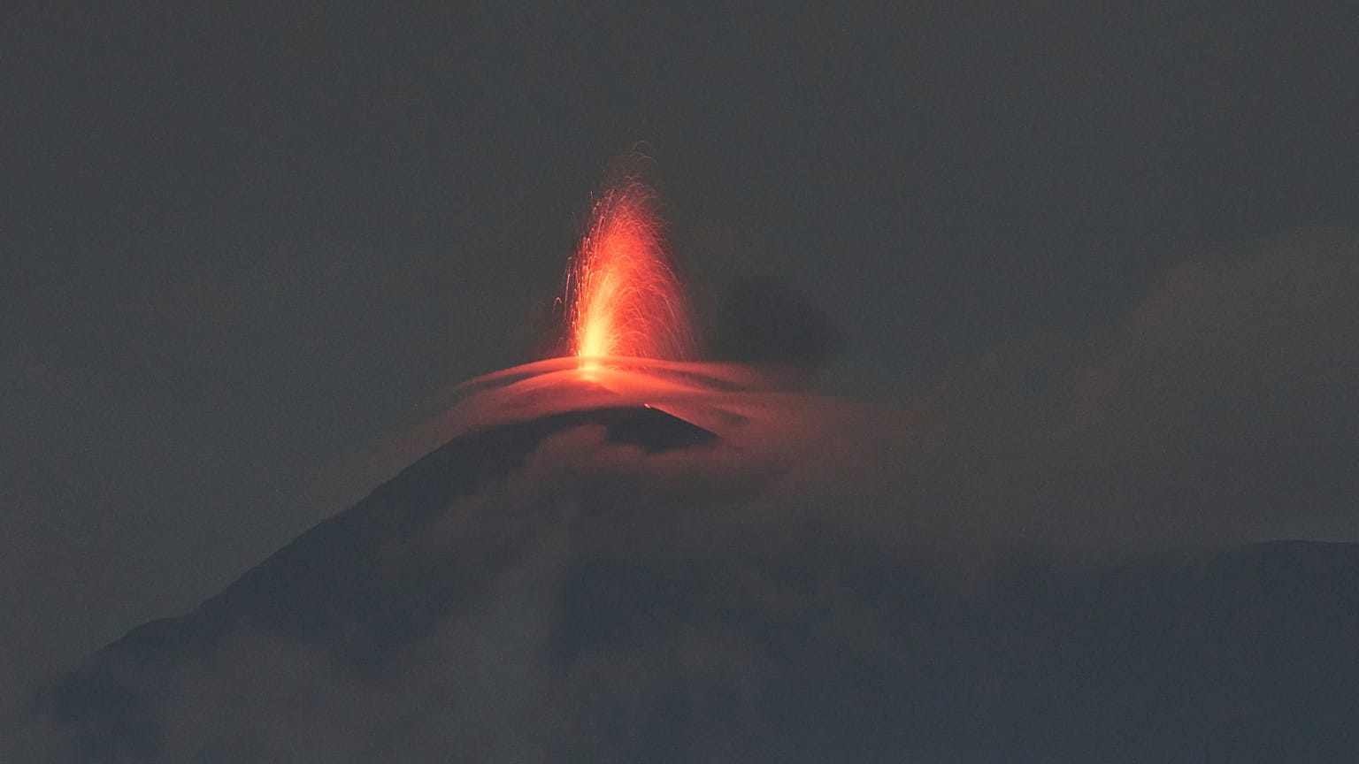 Lava flows out of the crater of the Fuego Volcano, 5 June, 2025