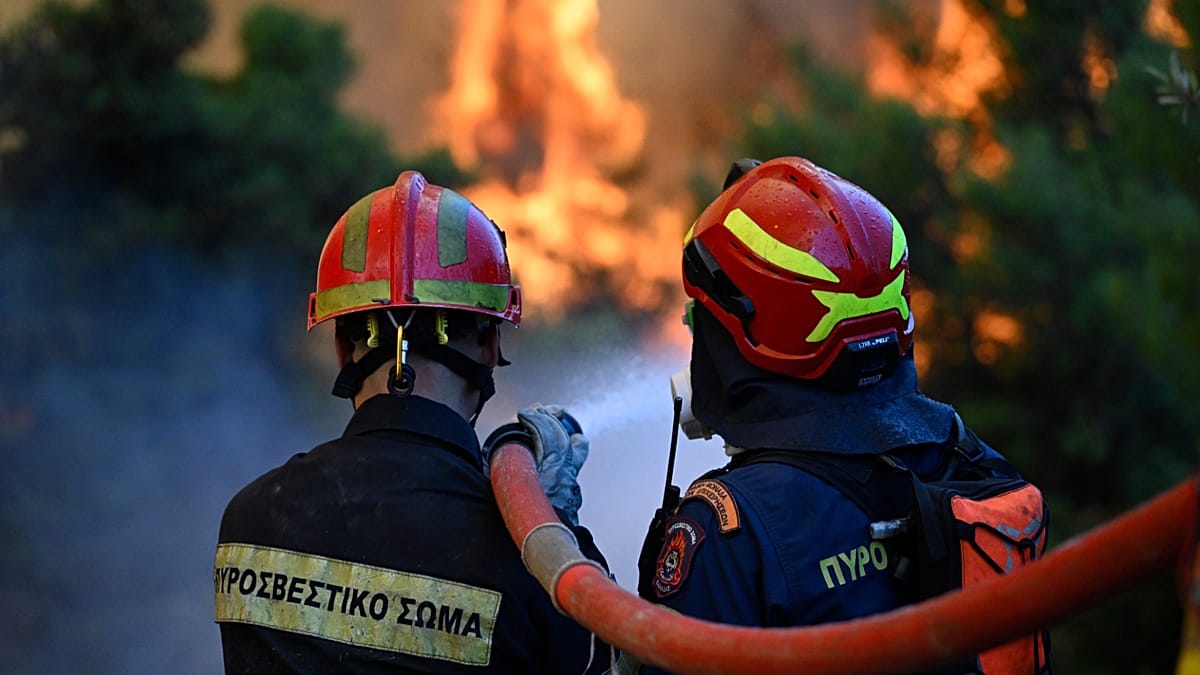 Greek firefighters hope to contain blaze near Athens as easing winds enable use of waterbombing aircraft