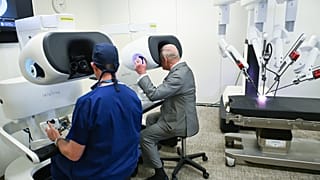 FILE - Britain's King Charles III, right, visits the King's College London Innovation Hub at Guy's Hospital Cancer Centre in London, May 11, 2026.