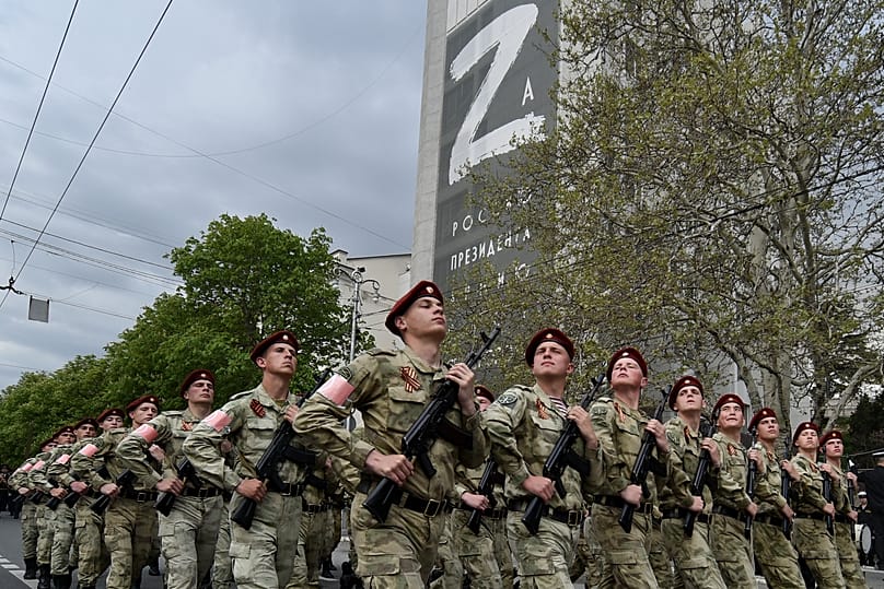 Russian National Guard servicemen march through a street in Sevastopol, 5 May, 2022