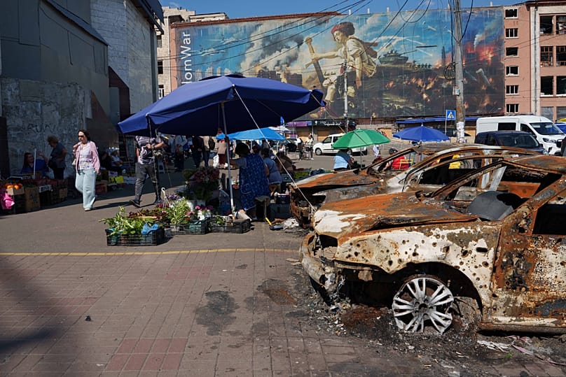 Destroyed cars sit after a Russian attack at the market in the Lukianivka neighbourhood of Kyiv, Ukraine, Thursday, June 11, 2026.