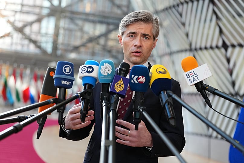 Lithuania's Foreign Minister Kęstutis Budrys speaks with the media as he arrives for a meeting of EU foreign ministers at the European Council building in Brussels, 16 March, 