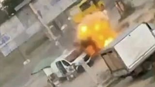 Screenshot of a video posted by Volodymyr Zelenskyy which shows a Kherson street vendor pursued by a Russian drone