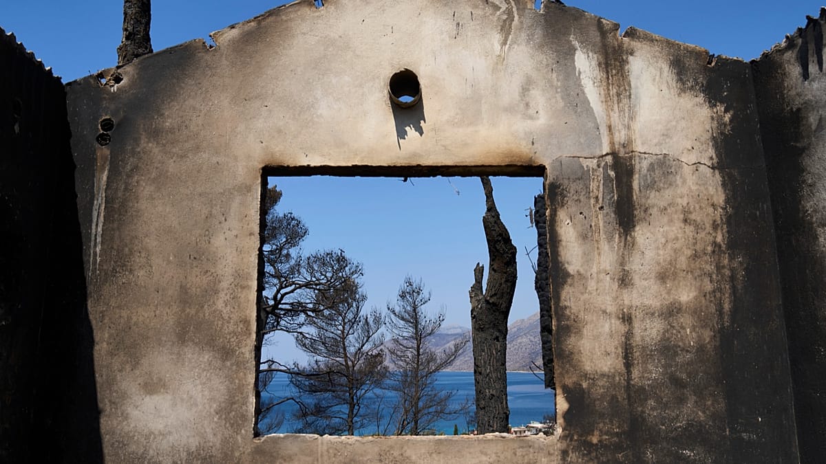 Firefighters scramble to contain fires outside Athens before high winds return