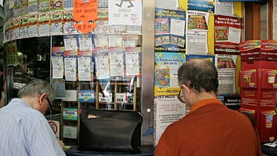 People queuing to play SuperEnalotto in Milan, Italy, on Tuesday 18 August 2009.