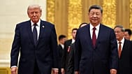 FILE - President Donald Trump, left, and Chinese President Xi Jinping arrive during a state dinner at the Great Hall of the People, May 14, 2026, in Beijing. 