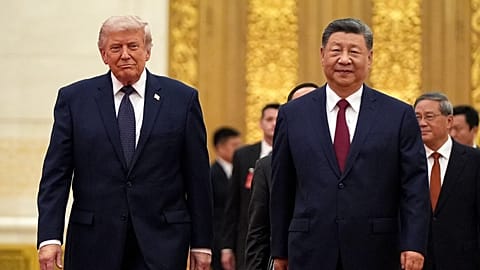 FILE - President Donald Trump, left, and Chinese President Xi Jinping arrive during a state dinner at the Great Hall of the People, May 14, 2026, in Beijing. 