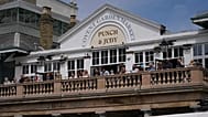 People sit on the terrace of a pub in Covent Garden, in London, Monday, June 29, 2026.