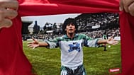A fan wears a shirt depicting Argentinian player Diego Maradona during the World Cup final soccer match between Argentina and Spain, Sunday, July 19, 2026