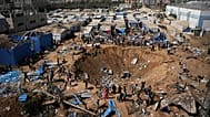 Palestinians inspect the scene of an Israeli airstrike near al-Aqsa Hospital in Deir al-Balah in the central Gaza Strip, Saturday, Aug. 1, 2026.
