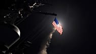 The guided-missile destroyer USS Porter launches a tomahawk land attack missile in the Mediterranean Sea, 7 April, 2017