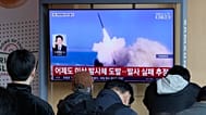 A TV screen shows a file image of North Korea's missile launch during a news program at Seoul Railway Station, 8 April, 2026