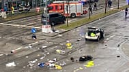 Emergency services attend the scene of an accident after a driver hit a group of people in Munich, 13 February, 2025