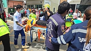 An injured person is carried on a stretcher after a school shooting in Thailand's Nonthaburi province, 7 August, 2026