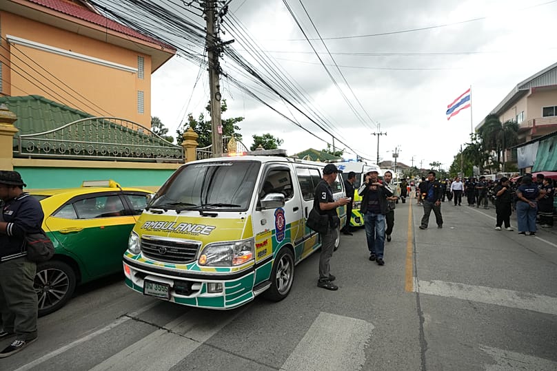 People gather outside after a shooting at the Debsirin Nonthaburi School in Thailand's Nonthaburi province, 7 August, 2026