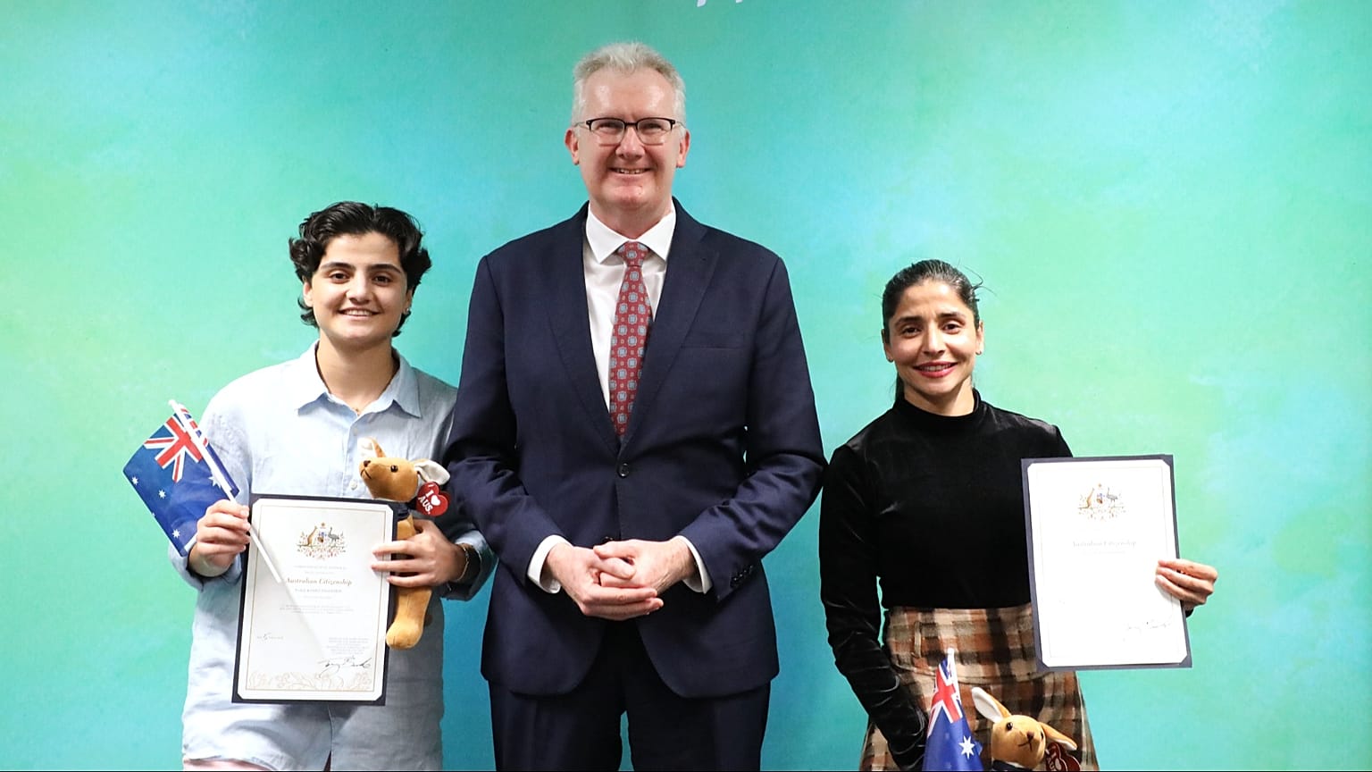 Fatemeh Pasandideh, left, and Atefeh Ramezanisadeh with Australia's Minister for Home Affairs Tony Burke in Brisbane, 5 August, 2026