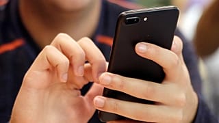 FILE - FILE - A person uses a smart phone in Chicago, Sept. 16, 2017. (AP Photo, File)