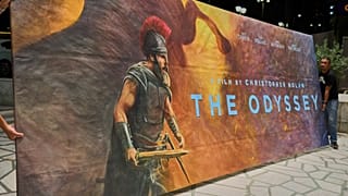 Workers install a hand-painted billboard, painted by Virginia Axioti, for Christopher Nolan's film "The Odyssey," outside Athen's Athinaion cinema, Saturday, July 11, 2026. 