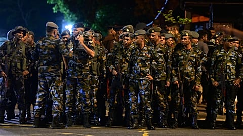 Sri Lankan soldiers stand outside the Magazine Prison following unrest in Colombo, 6 August, 2026