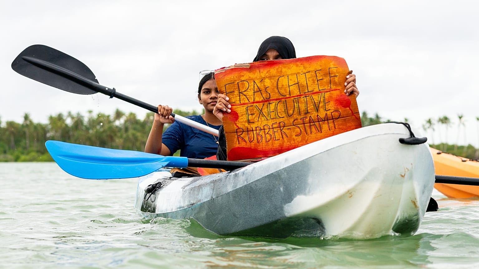 Participants join Project ThimaaVeshi, a youth-led demonstration against ongoing reclamation project damaging mangroves off the coast of Addu City, Maldives, June 3, 2026. 
