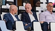 FIFA president Gianni Infantino, center, speaks to FIFA secretary general Mattias Grafstrom, left, sitting beside president of Moroccan Royal Football Federation Fouzi Lekjaa.