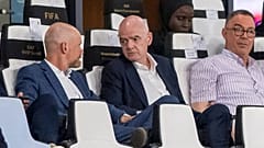 FIFA president Gianni Infantino, center, speaks to FIFA secretary general Mattias Grafstrom, left, sitting beside president of Moroccan Royal Football Federation Fouzi Lekjaa.