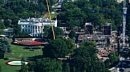 Construction continues on the White House helipad, left, and ballroom, right, Friday, Aug. 7, 2026, in Washington.