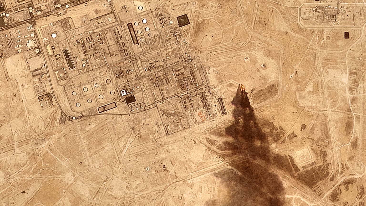 Previous Houthi claimed attack triggering smoke from a Saudi Aramco oil processing facility in Abqaiq, Saudi Arabia, 27 July 2026.