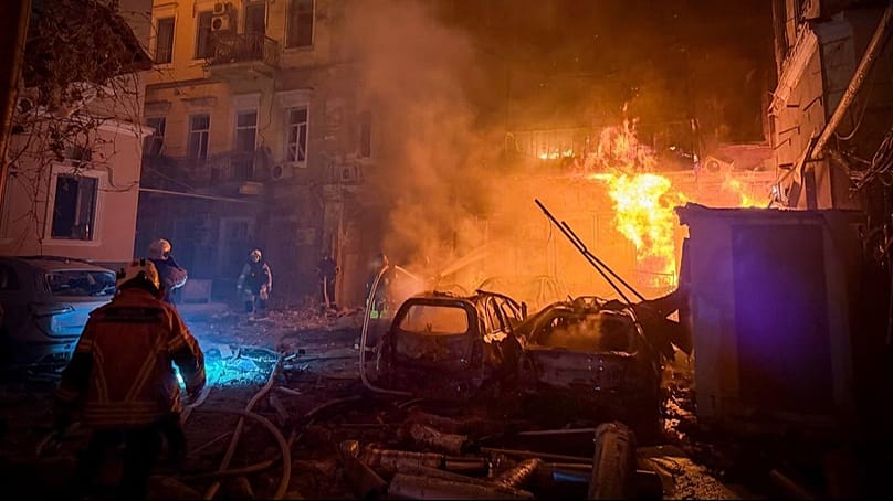 Emergency services personnel work to extinguish a fire of residential buildings following a Russian missiles attack in Odesa, Ukraine, Sunday, Aug. 9, 2026