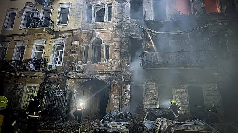 Emergency services personnel work to extinguish a fire of residential buildings following a Russian missiles attack in Odesa, Ukraine, Sunday, Aug. 9, 2026