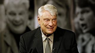 FILE - Former Golden State Warriors head coach Don Nelson smiles while being interviewed at the Warriors NBA training facility in Oakland, California, Tuesday, Aug. 28, 2012
