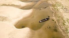 Usually submerged areas of the Danube River are exposed amid exceptionally low water levels, in Rasova, Romania, Monday, 4 August 2026.
