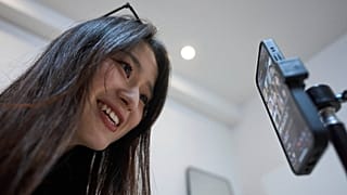 FILE - Tian Xin, a cyber matchmaker, hosts a livestream using the Chinese social media app Xiaohongshu (RedNote) from Hangzhou, China, early Friday, April 25, 2025.