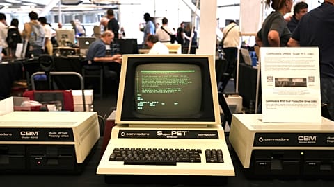 Software engineer Josh Dersch, standing, shows a 1970s Xerox Alto computer he restored at the Vintage Computer Festival in Mountain View, Calif., Sunday, Aug. 2, 2026.