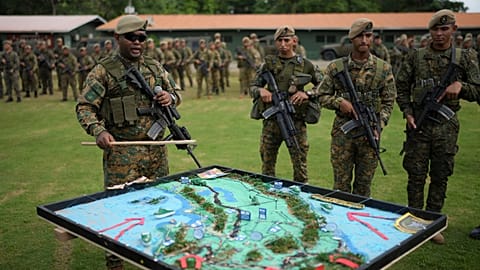 Panamanian border police prepare to deploy to reinforce security along the border with Colombia in Meteti, Panama, Sunday, Aug. 9, 2026. 