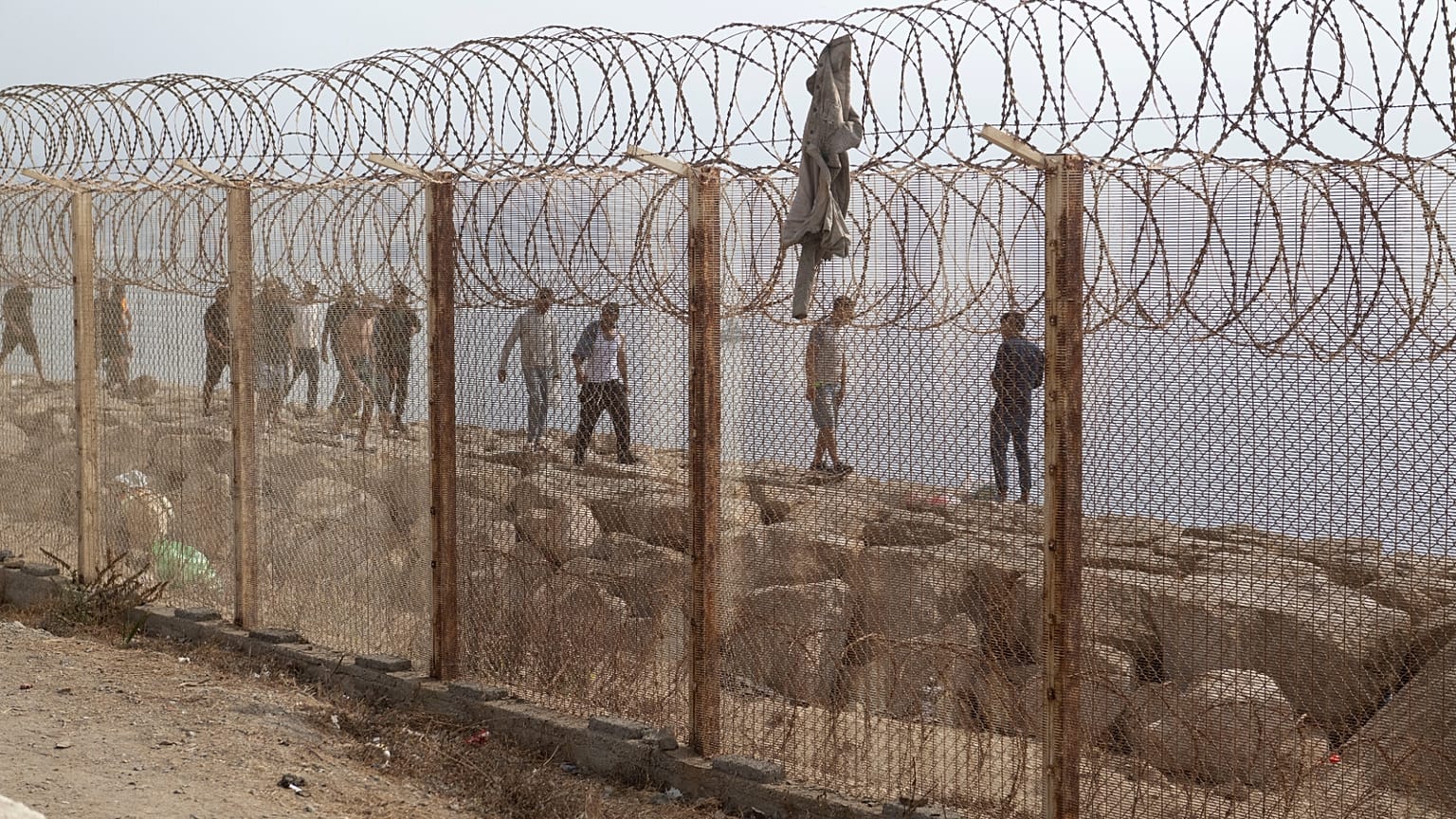 People who attempted crossing to the Spanish enclave of Ceuta return to the Moroccan northern town of Fnideq, Saturday, Aug. 1, 2026.