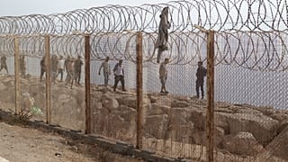 People who attempted crossing to the Spanish enclave of Ceuta return to the Moroccan northern town of Fnideq, Saturday, Aug. 1, 2026.