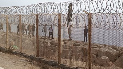 People who attempted crossing to the Spanish enclave of Ceuta return to the Moroccan northern town of Fnideq, Saturday, Aug. 1, 2026.